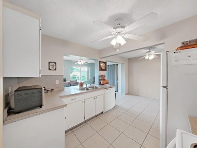Welcome to your sunny Florida retreat! This charming, move-in on Mainlands Golf Club in Florida - for sale on GolfHomes.com, golf home, golf lot