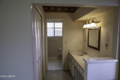 A 2 Bedroom with a Den/2 Bath end unit in the Woodside on Spruce Creek Golf Club in Florida - for sale on GolfHomes.com, golf home, golf lot