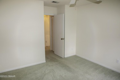 A 2 Bedroom with a Den/2 Bath end unit in the Woodside on Spruce Creek Golf Club in Florida - for sale on GolfHomes.com, golf home, golf lot