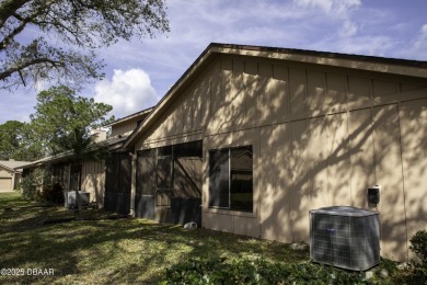 A 2 Bedroom with a Den/2 Bath end unit in the Woodside on Spruce Creek Golf Club in Florida - for sale on GolfHomes.com, golf home, golf lot