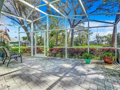 Discover tranquil living with a water view in Pinehurst Village! on Palm Aire Country Club of Sarasota in Florida - for sale on GolfHomes.com, golf home, golf lot