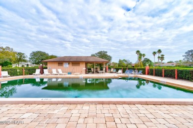 A 2 Bedroom with a Den/2 Bath end unit in the Woodside on Spruce Creek Golf Club in Florida - for sale on GolfHomes.com, golf home, golf lot