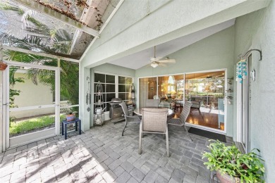 Discover tranquil living with a water view in Pinehurst Village! on Palm Aire Country Club of Sarasota in Florida - for sale on GolfHomes.com, golf home, golf lot