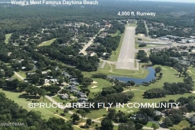 A 2 Bedroom with a Den/2 Bath end unit in the Woodside on Spruce Creek Golf Club in Florida - for sale on GolfHomes.com, golf home, golf lot