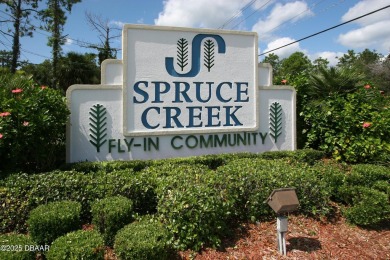 A 2 Bedroom with a Den/2 Bath end unit in the Woodside on Spruce Creek Golf Club in Florida - for sale on GolfHomes.com, golf home, golf lot