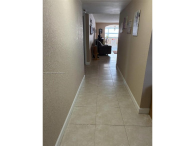 Don't miss this incredible opportunity to own a spacious on Sunrise Lakes Phase IV Golf Course in Florida - for sale on GolfHomes.com, golf home, golf lot