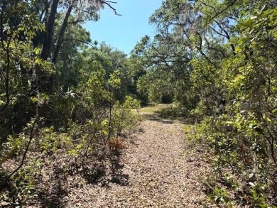 This beautiful 1-acre vacant lot offers an excellent opportunity on Inverness Golf and Country Club in Florida - for sale on GolfHomes.com, golf home, golf lot