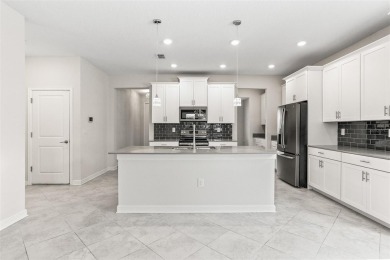 Don't miss out on this stunning 5-bed, 4.5-bath, 3,800+ sq ft on The Oasis Club at Champions Gate in Florida - for sale on GolfHomes.com, golf home, golf lot