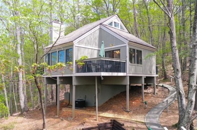 This spectacular villa offers seasonal views of Lake Petit and on Big Canoe Golf Club - Cherokee in Georgia - for sale on GolfHomes.com, golf home, golf lot