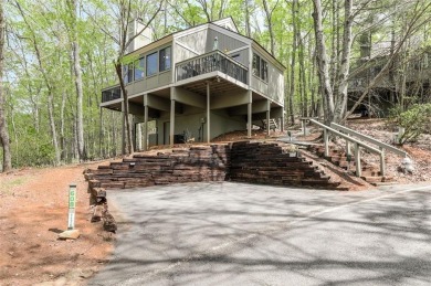 This spectacular villa offers seasonal views of Lake Petit and on Big Canoe Golf Club - Cherokee in Georgia - for sale on GolfHomes.com, golf home, golf lot