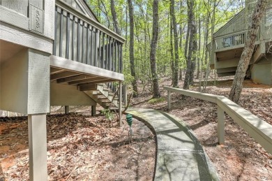 This spectacular villa offers seasonal views of Lake Petit and on Big Canoe Golf Club - Cherokee in Georgia - for sale on GolfHomes.com, golf home, golf lot
