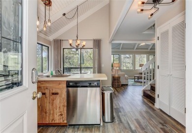 This spectacular villa offers seasonal views of Lake Petit and on Big Canoe Golf Club - Cherokee in Georgia - for sale on GolfHomes.com, golf home, golf lot