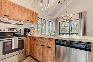 This spectacular villa offers seasonal views of Lake Petit and on Big Canoe Golf Club - Cherokee in Georgia - for sale on GolfHomes.com, golf home, golf lot