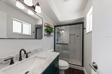 Welcome to a rare Mid-Century Modern tri-level gem in the highly on Seminole Lake Country Club in Florida - for sale on GolfHomes.com, golf home, golf lot