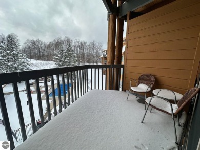 Enjoy a view of the pool from this nicely updated 1 bedroom on Cedar River Golf Course in Michigan - for sale on GolfHomes.com, golf home, golf lot