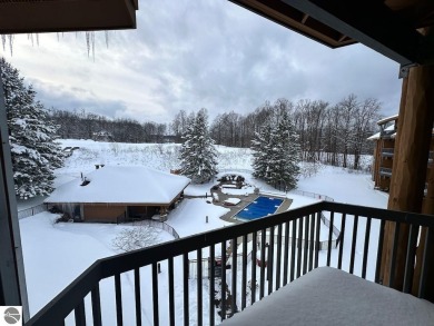 Enjoy a view of the pool from this nicely updated 1 bedroom on Cedar River Golf Course in Michigan - for sale on GolfHomes.com, golf home, golf lot