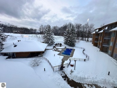 Enjoy a view of the pool from this nicely updated 1 bedroom on Cedar River Golf Course in Michigan - for sale on GolfHomes.com, golf home, golf lot