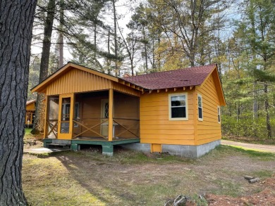 This cozy 2 bedroom cottage sits quite close to the lake with on  in Wisconsin - for sale on GolfHomes.com, golf home, golf lot