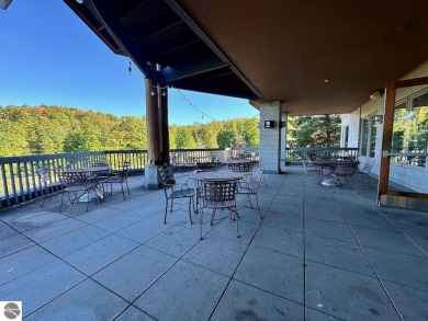 Enjoy a view of the pool from this nicely updated 1 bedroom on Cedar River Golf Course in Michigan - for sale on GolfHomes.com, golf home, golf lot