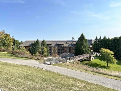 Enjoy a view of the pool from this nicely updated 1 bedroom on Cedar River Golf Course in Michigan - for sale on GolfHomes.com, golf home, golf lot