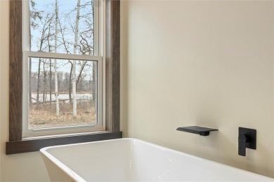 Discover this newly built 3-bedroom, 3-bath plus office home in on Crosswoods Golf Course - Crosswoods in Minnesota - for sale on GolfHomes.com, golf home, golf lot