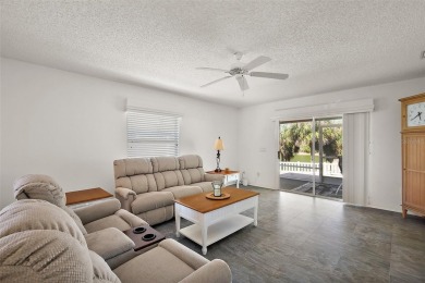 Welcome to this WATERFRONT 2/2 Marathon Courtyard Villa with a on The Links of Spruce Creek in Florida - for sale on GolfHomes.com, golf home, golf lot