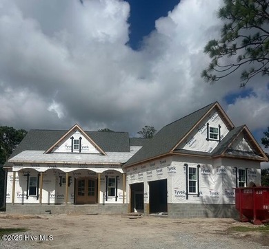 A gorgeous new home on the fairways of the prestigious Tiger's on Ocean Ridge Plantation in North Carolina - for sale on GolfHomes.com, golf home, golf lot