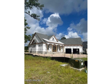 A gorgeous new home on the fairways of the prestigious Tiger's on Ocean Ridge Plantation in North Carolina - for sale on GolfHomes.com, golf home, golf lot