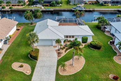 PRIME WATERFRONT LOCATION IN PUNTA GORDA ISLES! ATTRACTIVE 2 on Saint Andrews South Golf Club in Florida - for sale on GolfHomes.com, golf home, golf lot