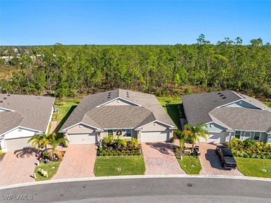 This coastal contemporary home with private preserve view will on Herons Glen Golf and Country Club in Florida - for sale on GolfHomes.com, golf home, golf lot