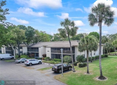 Lovely light and bright first floor corner unit overlooking the on Deer Creek Golf Club in Florida - for sale on GolfHomes.com, golf home, golf lot
