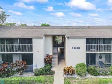 Lovely light and bright first floor corner unit overlooking the on Deer Creek Golf Club in Florida - for sale on GolfHomes.com, golf home, golf lot