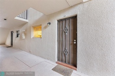 Lovely light and bright first floor corner unit overlooking the on Deer Creek Golf Club in Florida - for sale on GolfHomes.com, golf home, golf lot