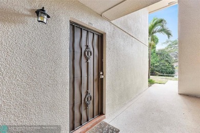 Lovely light and bright first floor corner unit overlooking the on Deer Creek Golf Club in Florida - for sale on GolfHomes.com, golf home, golf lot