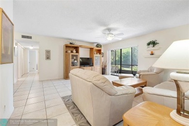 Lovely light and bright first floor corner unit overlooking the on Deer Creek Golf Club in Florida - for sale on GolfHomes.com, golf home, golf lot