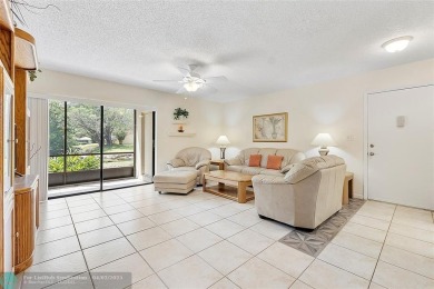 Lovely light and bright first floor corner unit overlooking the on Deer Creek Golf Club in Florida - for sale on GolfHomes.com, golf home, golf lot