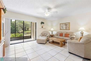 Lovely light and bright first floor corner unit overlooking the on Deer Creek Golf Club in Florida - for sale on GolfHomes.com, golf home, golf lot