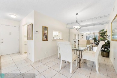 Lovely light and bright first floor corner unit overlooking the on Deer Creek Golf Club in Florida - for sale on GolfHomes.com, golf home, golf lot