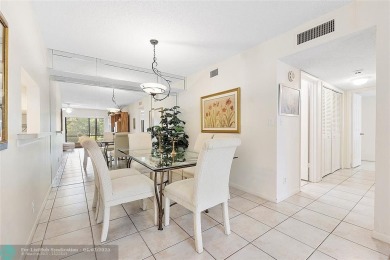 Lovely light and bright first floor corner unit overlooking the on Deer Creek Golf Club in Florida - for sale on GolfHomes.com, golf home, golf lot