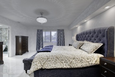 This extraordinary, designer-renovated 4-bedroom, 3-bath on Sugar Mill Country Club in Florida - for sale on GolfHomes.com, golf home, golf lot