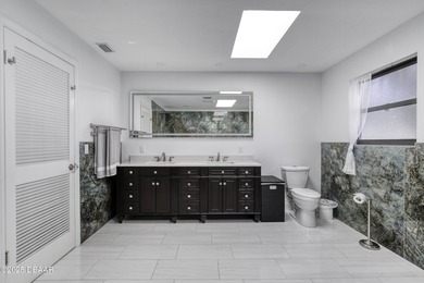 This extraordinary, designer-renovated 4-bedroom, 3-bath on Sugar Mill Country Club in Florida - for sale on GolfHomes.com, golf home, golf lot