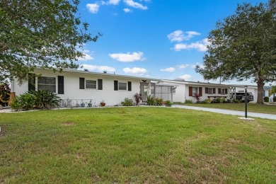 Adorable MOVE-IN READY 2-bedroom, 2-bathroom home with a POND on North Lakes Golf Course in Florida - for sale on GolfHomes.com, golf home, golf lot
