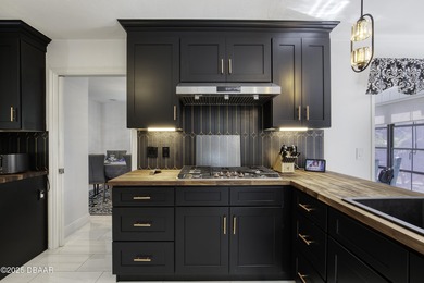 This extraordinary, designer-renovated 4-bedroom, 3-bath on Sugar Mill Country Club in Florida - for sale on GolfHomes.com, golf home, golf lot