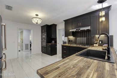 This extraordinary, designer-renovated 4-bedroom, 3-bath on Sugar Mill Country Club in Florida - for sale on GolfHomes.com, golf home, golf lot