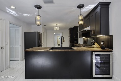 This extraordinary, designer-renovated 4-bedroom, 3-bath on Sugar Mill Country Club in Florida - for sale on GolfHomes.com, golf home, golf lot