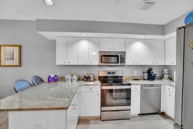 Lovely Harbor front unit with sunny eastern exposure. Beautiful on Grand Harbor Golf and Country Club in Florida - for sale on GolfHomes.com, golf home, golf lot