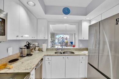 Lovely Harbor front unit with sunny eastern exposure. Beautiful on Grand Harbor Golf and Country Club in Florida - for sale on GolfHomes.com, golf home, golf lot