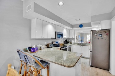 Lovely Harbor front unit with sunny eastern exposure. Beautiful on Grand Harbor Golf and Country Club in Florida - for sale on GolfHomes.com, golf home, golf lot