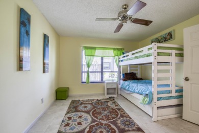 Discover sweeping golf course and lake views at this serene on Old Marsh Golf Club in Florida - for sale on GolfHomes.com, golf home, golf lot