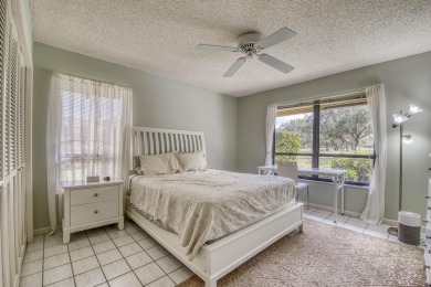 Discover sweeping golf course and lake views at this serene on Old Marsh Golf Club in Florida - for sale on GolfHomes.com, golf home, golf lot